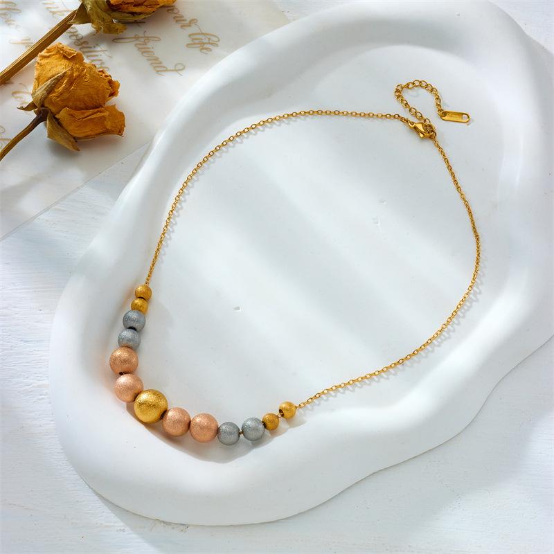 

Gold Tri-color Frosted Bead Station Necklace золотой