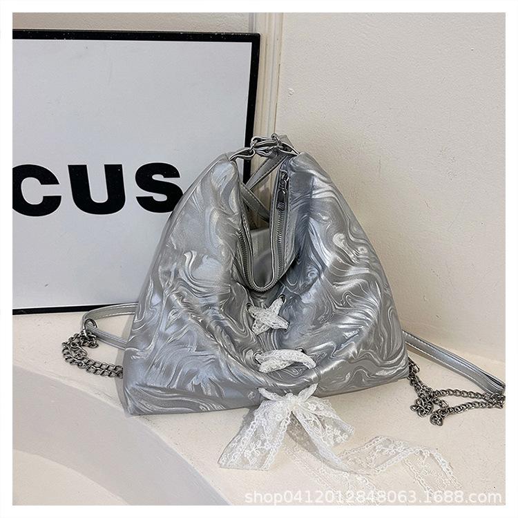 

Korean version lace-up bow tote big bag 2025 new large-capacity foreign-style shoulder bag fashionable commuter backpack серебряный