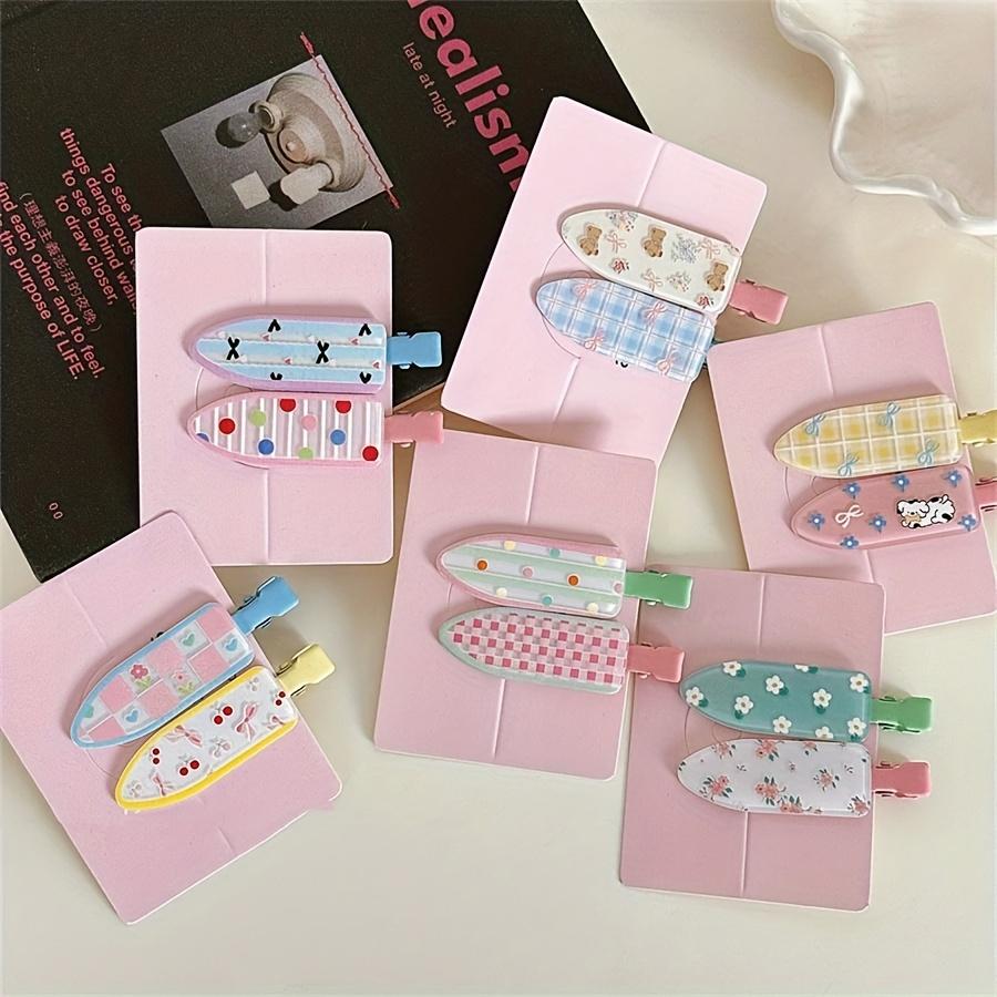 A Set of Two Cute Floral Hair Clips with Polka Dots, Designed for a Youthful Look, Perfect for Holding Bangs Without Leaving Marks.