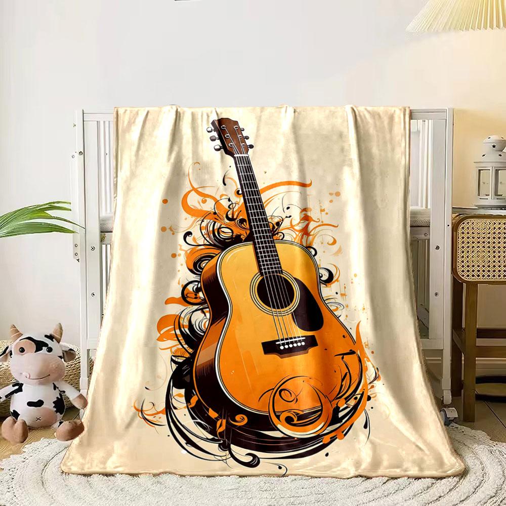 A guitar surrounded by swirling orange and black abstract designs. for all seasons blanket lunch break throw gift 80cm x 120cm
