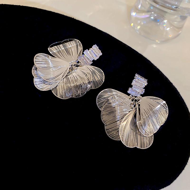 Silver needle exaggerated wind zircon hollow petal stud earrings light luxury niche design earrings cold wind temperament earrings
