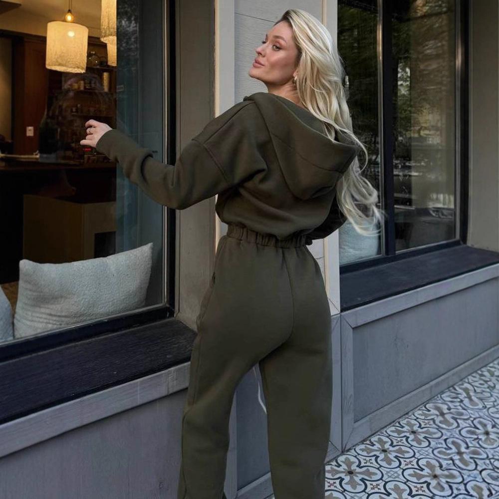 Tuta intera da donna casual europea e americana con cappuccio in vita a tinta unita a maniche lunghe con cerniera sportiva intera