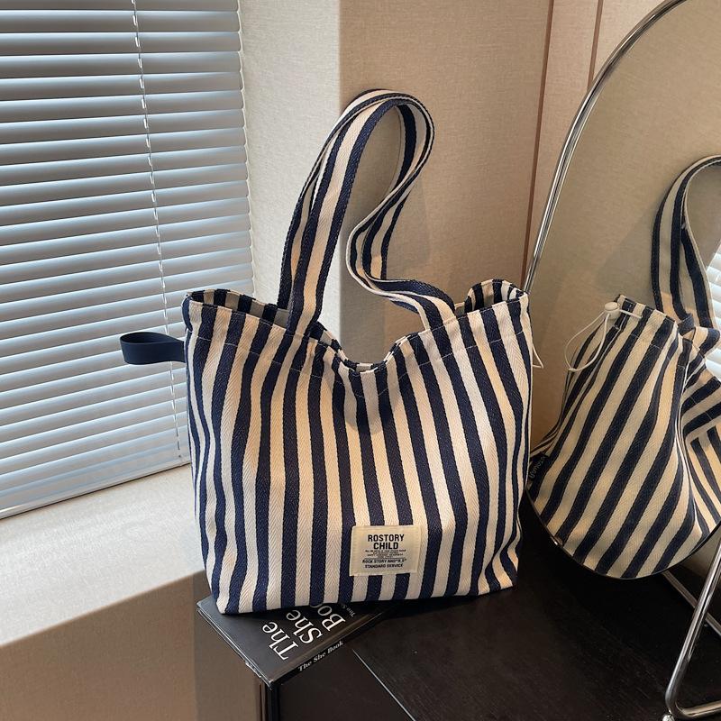 

Large capacity striped tote bag women s 2025 fashion commuter double-sided canvas bag Korean simple shoulder oblique span bag