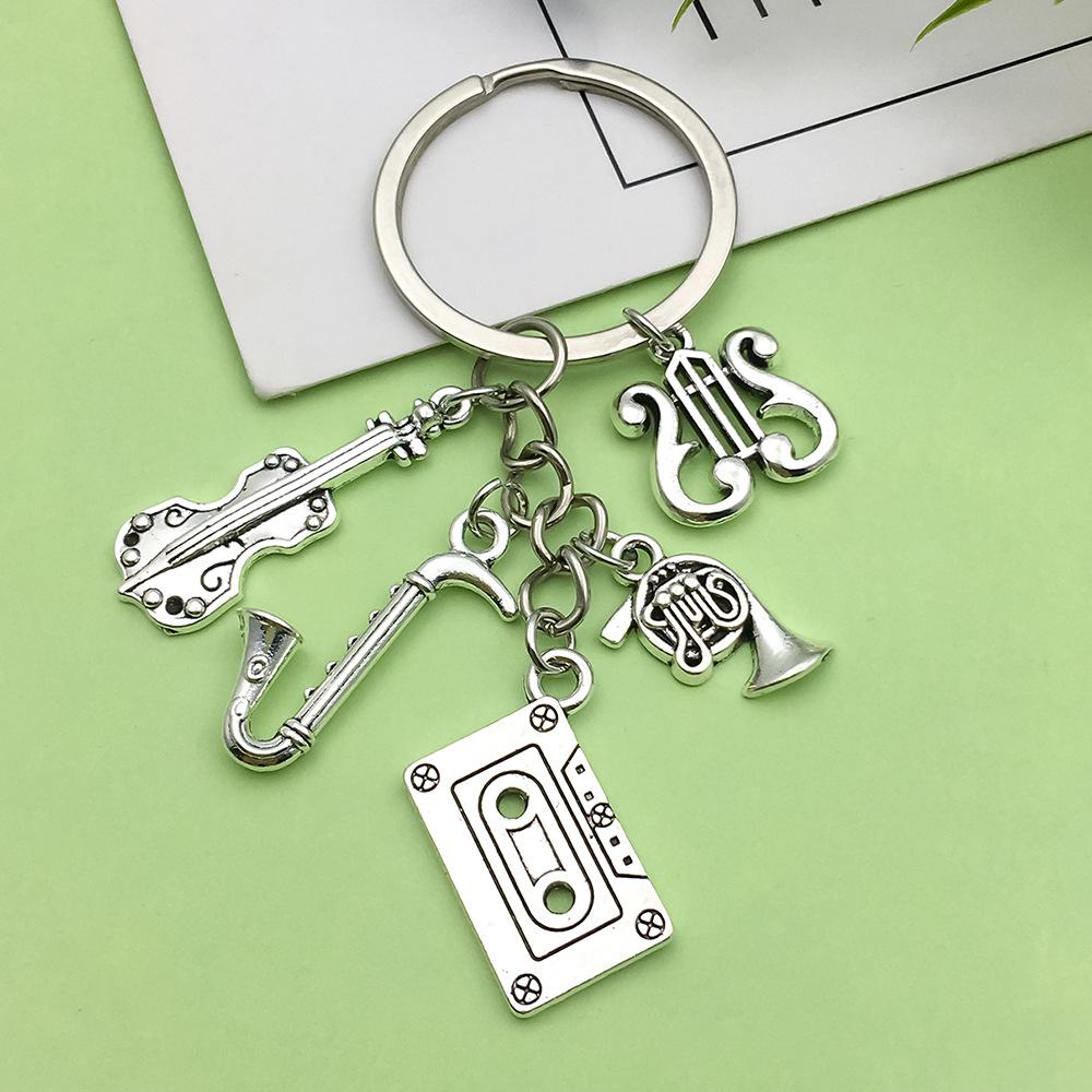 Antique Silver Music Cassette & Saxophone Keychain with Creative Design