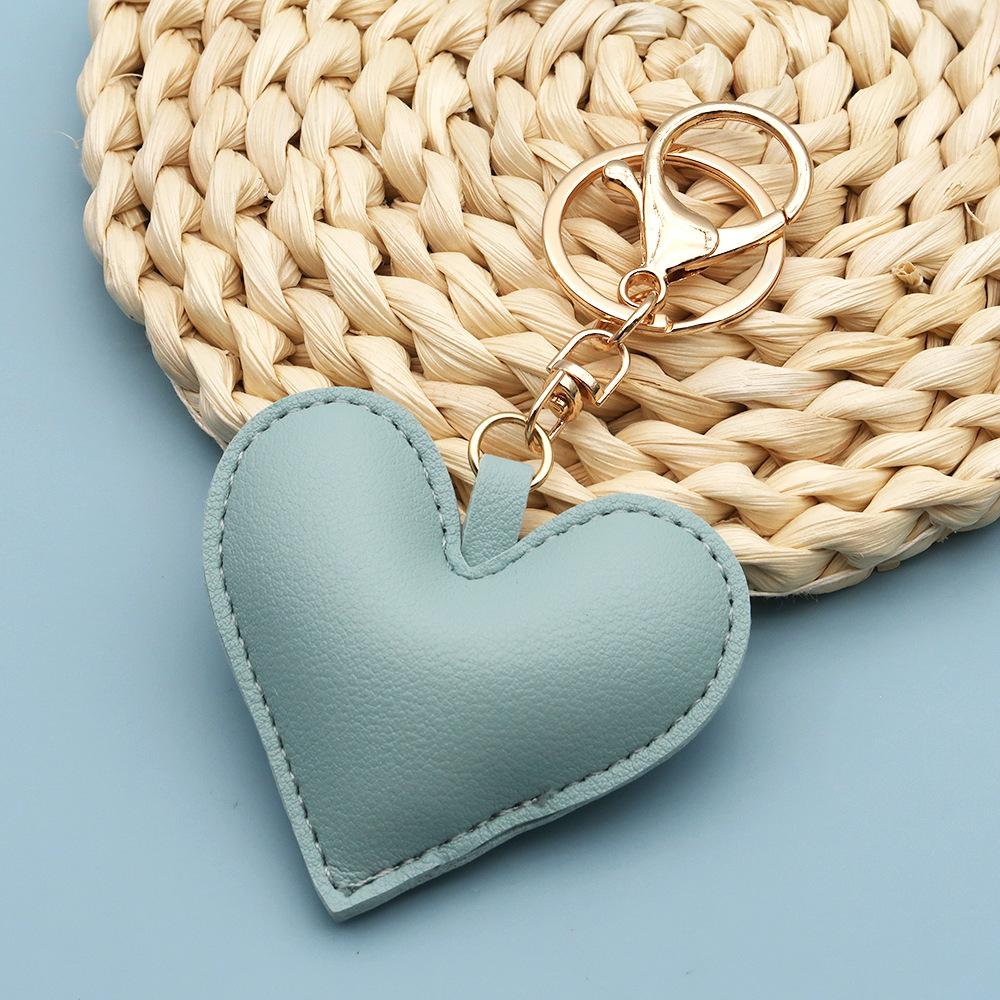 Spot wholesale PU simple peach heart bag pendant Xiaohongshu explosive love couple pendant keychain bag lanyard
