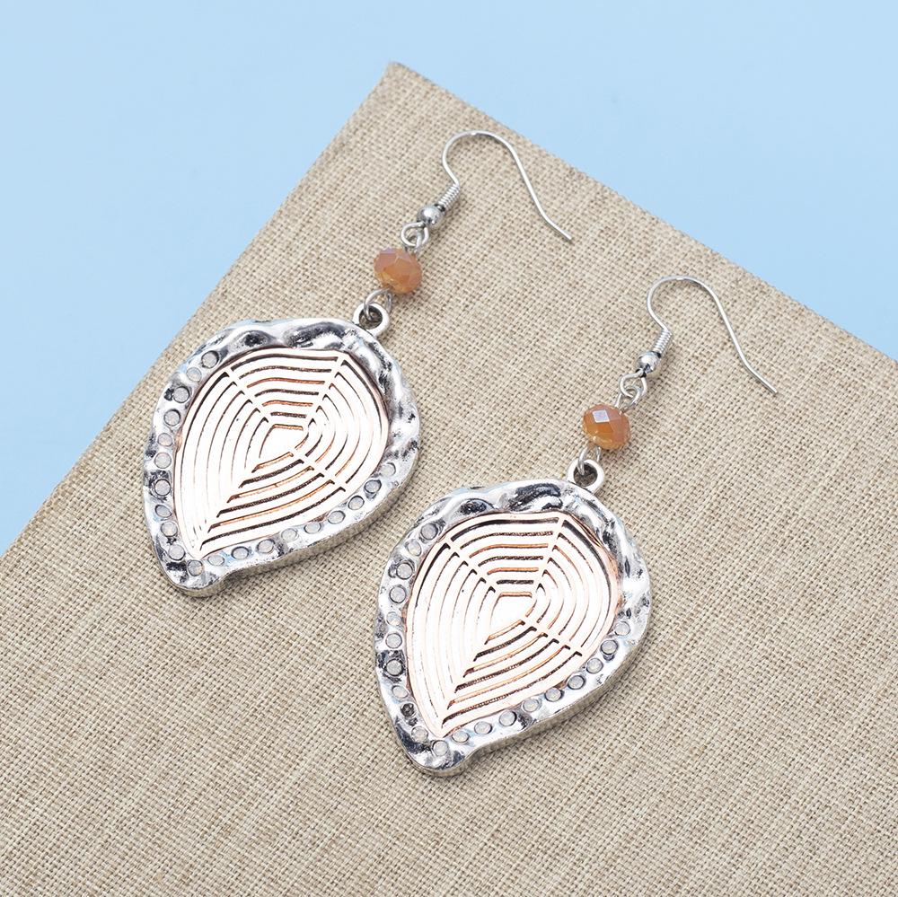 

Two-Tone Electroplated Metal Leaf & Water Drop Earrings with Hollowed Zinc Alloy Chip Design