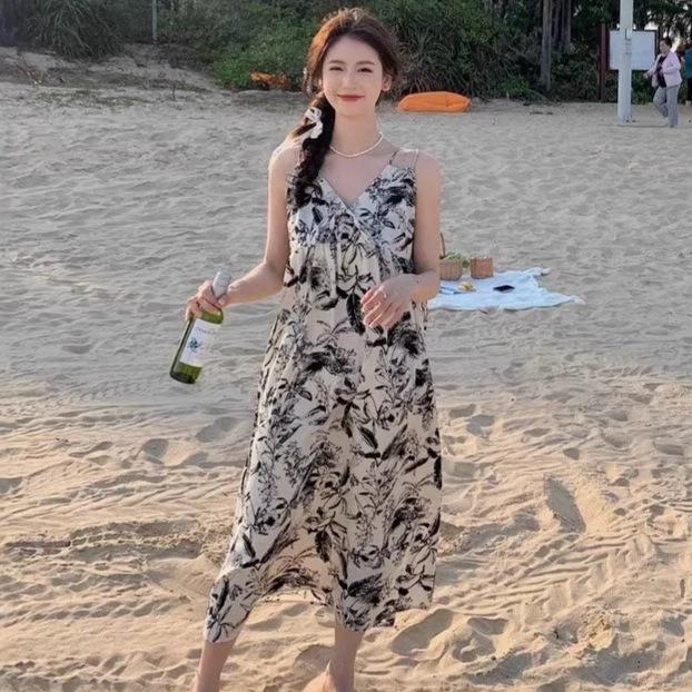 Holiday wind floral v-neck halter suspender dress for women's summer niche loose waist over knee A-shaped long dress wholesale