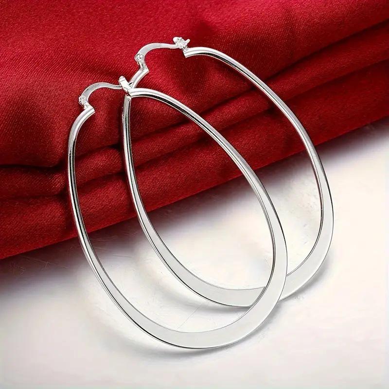 

Elegant Teardrop Hoop Earrings for Women - Stylish and Chic Design серебряный