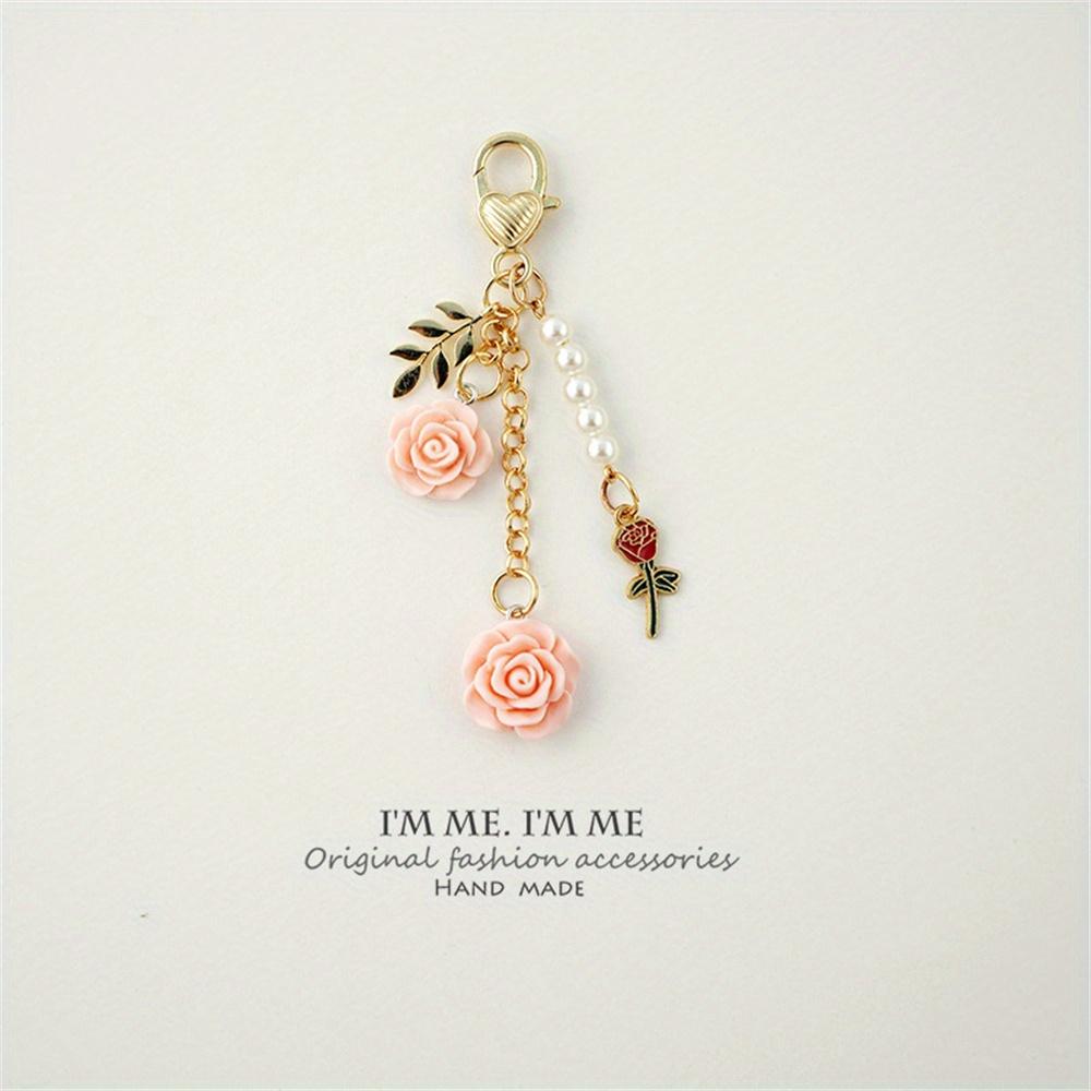 3D ვარდის ფისოვანი კამელიის გულსაკიდი გასაღების საკიდი მარგალიტის შენადნობი ქალებისთვის მანქანის გასაღების საკიდი ყურსასმენის ქეისი ხელჩანთის აქსესუარები