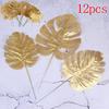 12 stk gull Kunstige falske palmeblader grønne planter Hjem bryllup DIY dekorasjon