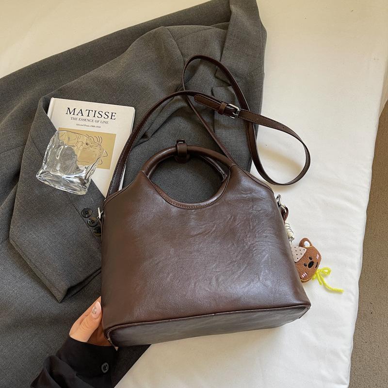

Premium hand bag women s 2025 new trendy autumn and winter niche light luxury shoulder bag commuter messenger bucket bag темно-коричневого кольору