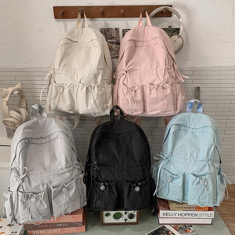 Large capacity schoolbag female junior high school student cute bow high school large backpack female student high value college backpack