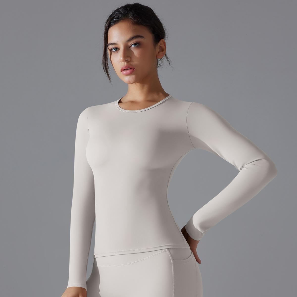 

Новый тренд одежды для йоги Спортивный топ с длинным рукавом однотонный прилегающего кроя эластичный для фитнеса и формирования фигуры для бега и тренировок для женщин S белый