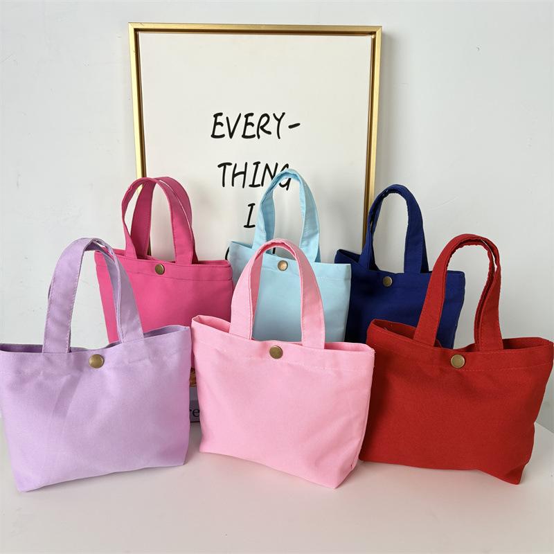 Effenkleurige eenvoudige lunchtas, draagbare canvas tas, kleine stoffen tas, draagbare canvas tas voor het opbergen van diverse spullen