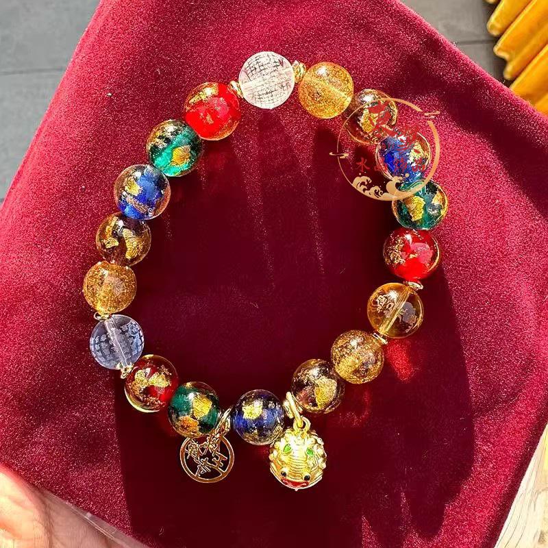 Duobao Gold Foil Glass Beaded Bracelet: Majestic Lion & Sutra Design with Blue, Yellow Accents