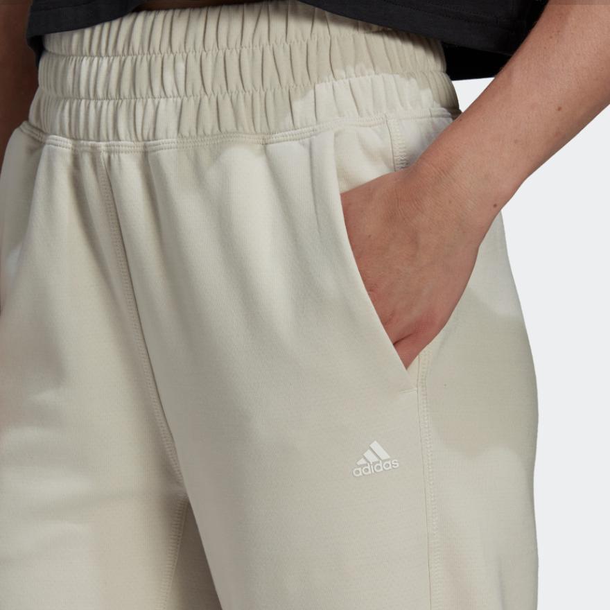 Adidas Spodnie sportowe damskie z mankietami, jednolity kolor, nadruk logo, elastyczny pas, białe HK2364