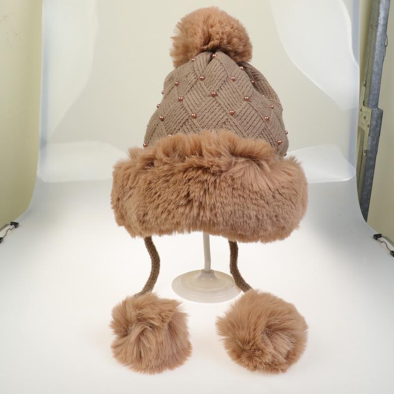 Winter Women's Knitted Hat with Beads and Fur Pom, Featuring a Velvet Lining, Large Fur Brim, and Warm Ear Protection.