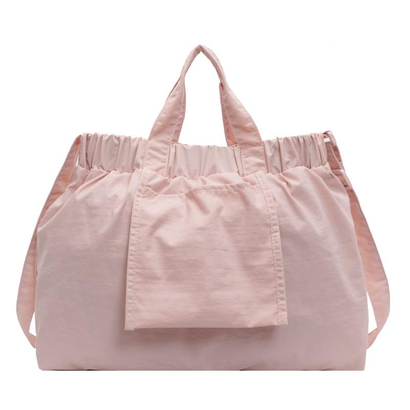 

Niche casual simple messenger bag bag elastic band design portable tote bag large capacity dopamine shoulder women s bag one size fits all розовый