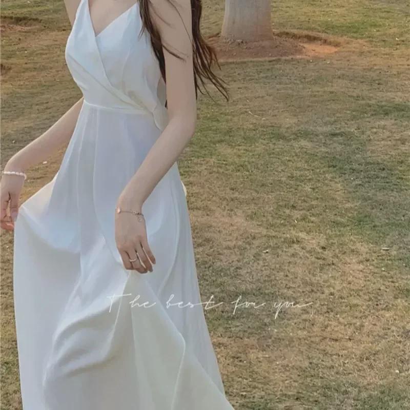 Stylish Backless V-Neck Summer Dress with Lined Skirt In Trendy White.