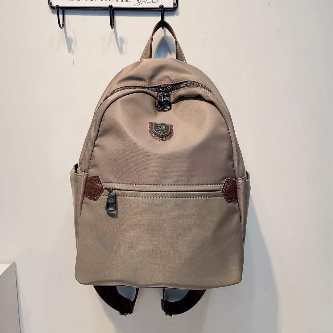 

Новый женский водонепроницаемый рюкзак из ткани Оксфорд, простая и повседневная однотонная сумка для поездок на работу, универсальная и модная женская сумка хаки