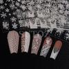 Winterweiße Weihnachts-Nagelsticker: Glitzernde Schneeflocken-, Herz- und Rentierdesigns