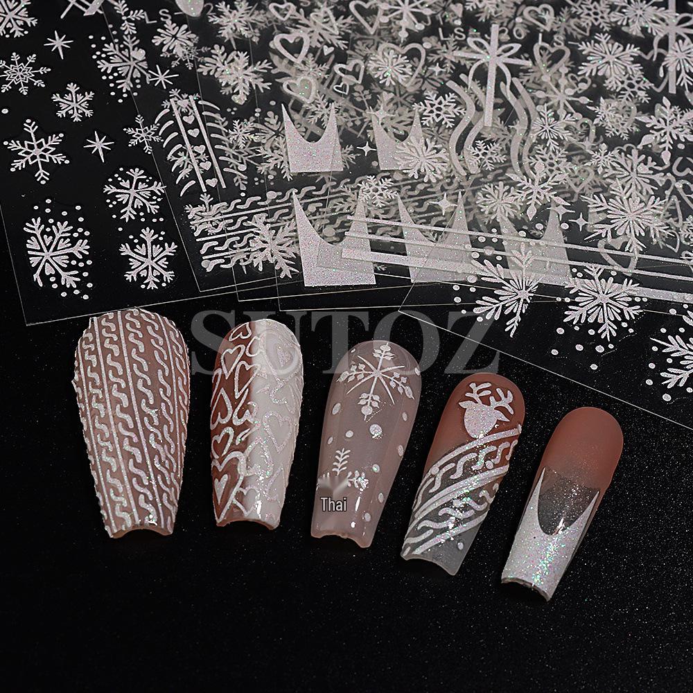 Winterweiße Weihnachts-Nagelsticker: Glitzernde Schneeflocken-, Herz- und Rentierdesigns