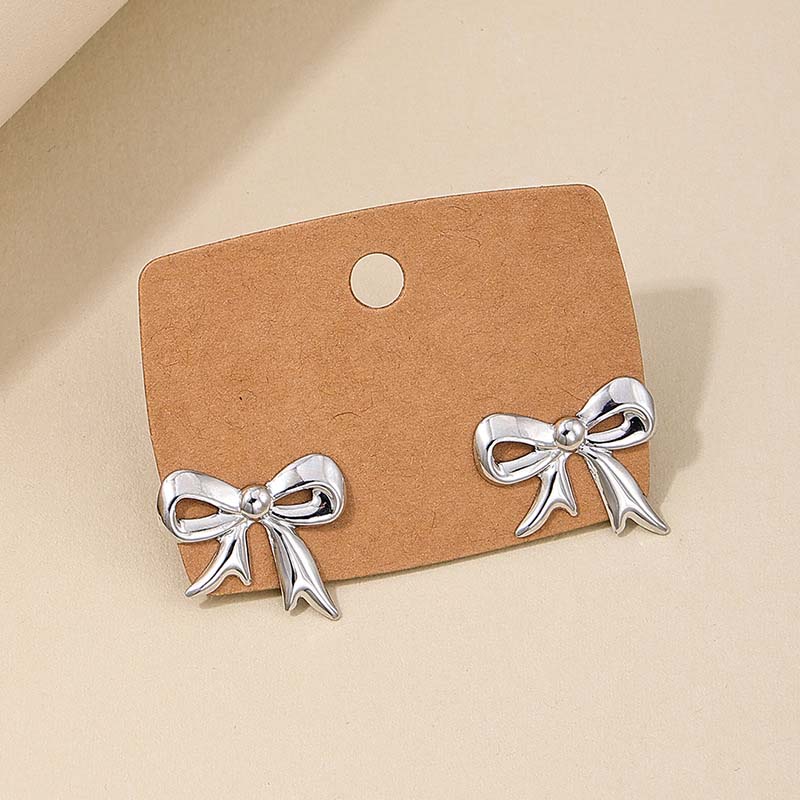 

Fashion Gold Color Bow Stud Earrings For Women 2025 New Trendy Metal Bowknot Ribbon Piercing Earring Zircon Brincos Gifts