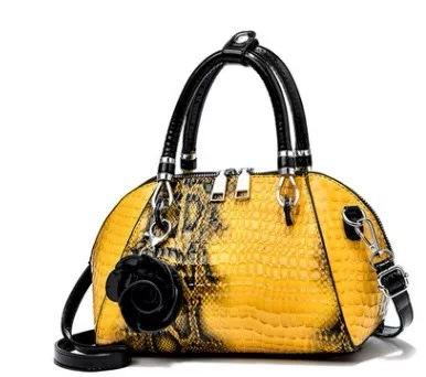 Eine neue Schlangenleder-Muster einfache Crossbody-Schultertasche große Kapazität modische PU-Damenhandtasche
