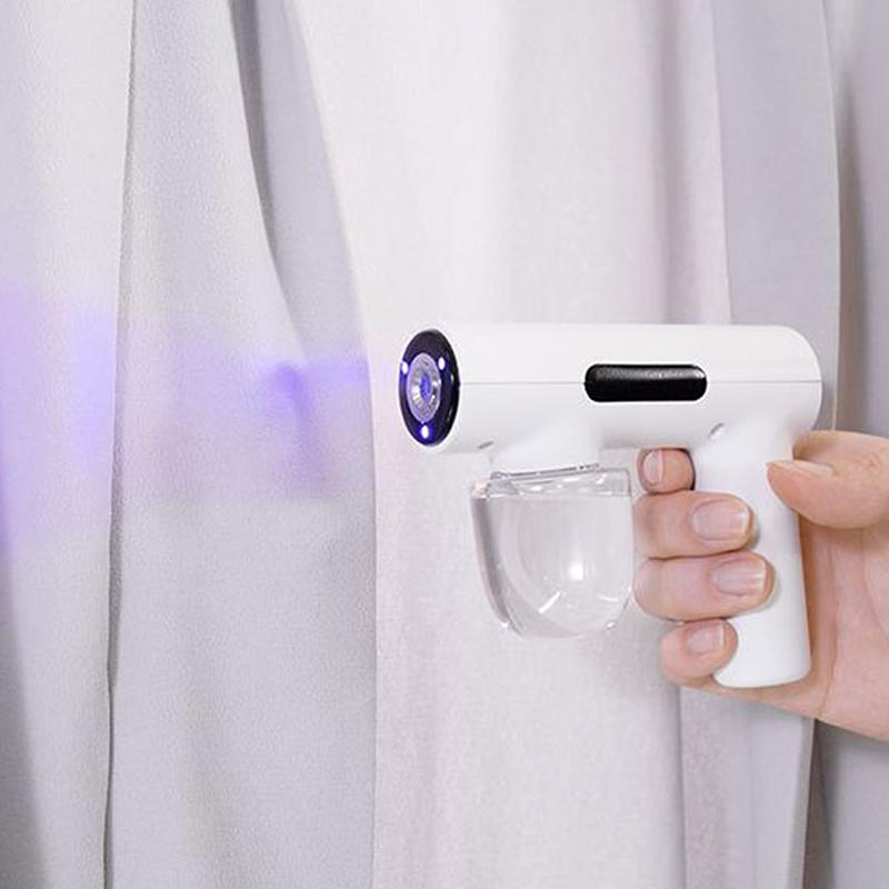Tragbare Hand-Elektro-Befeuchtungssprühpistole Haushalts-Reisebedarf Zerstäubtes Blaues Licht Wiederaufladbare Desinfektionspistole