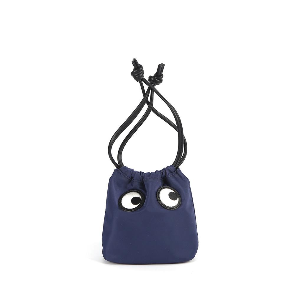 26 New niche big eyes arm bag waterproof nylon drawstring cute bucket cosmetic bag casual mini women s bag
