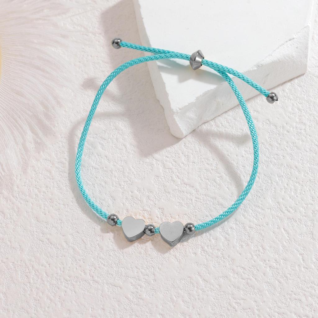 Minimalistisches blaues Seilarmband mit Herz-, Männchen- und runden Anhängern aus Edelstahl