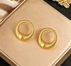 Stainless steel high-end gold earrings, niche design light luxury metal studs, temperament earrings