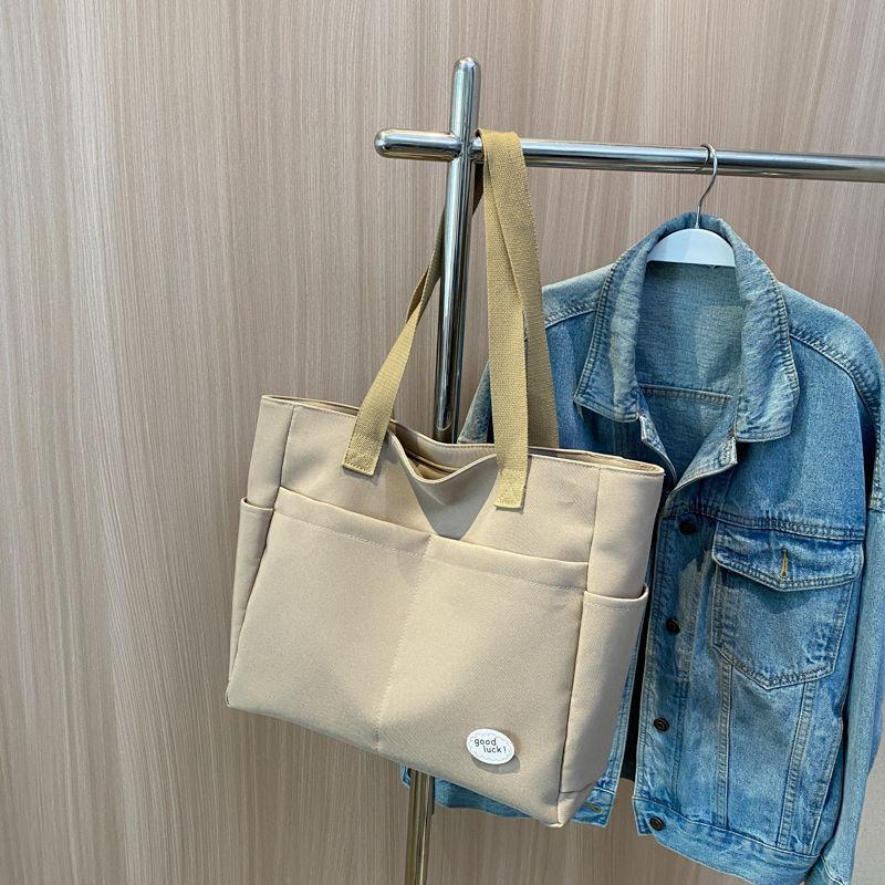 Large capacity lazy wind canvas bag women's solid color niche shoulder handbag casual versatile commuter tote bag
