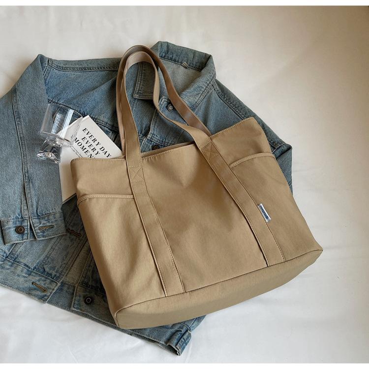 

Холщовая сумка женская 2025 новая летняя повседневная вместительная сумка-тоут для поездок на работу простая в иностранном стиле студенческая сумка через плечо хаки