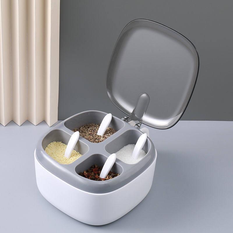 Four-Compartment Kitchen Seasoning Storage Box with Lid for Salt, MSG, and Pepper.