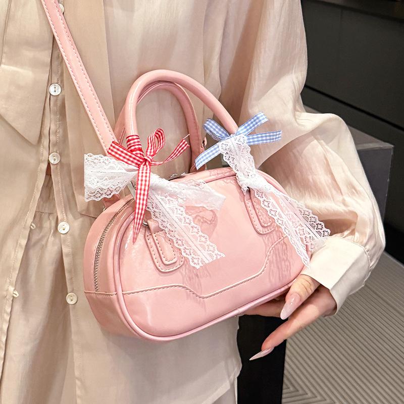 Frühling 2025 neu Ou Ruofeng Koreanische Version von einfacher tragbarer Boston-Tasche Nische lässig vielseitige Umhängetasche Tasche Damen