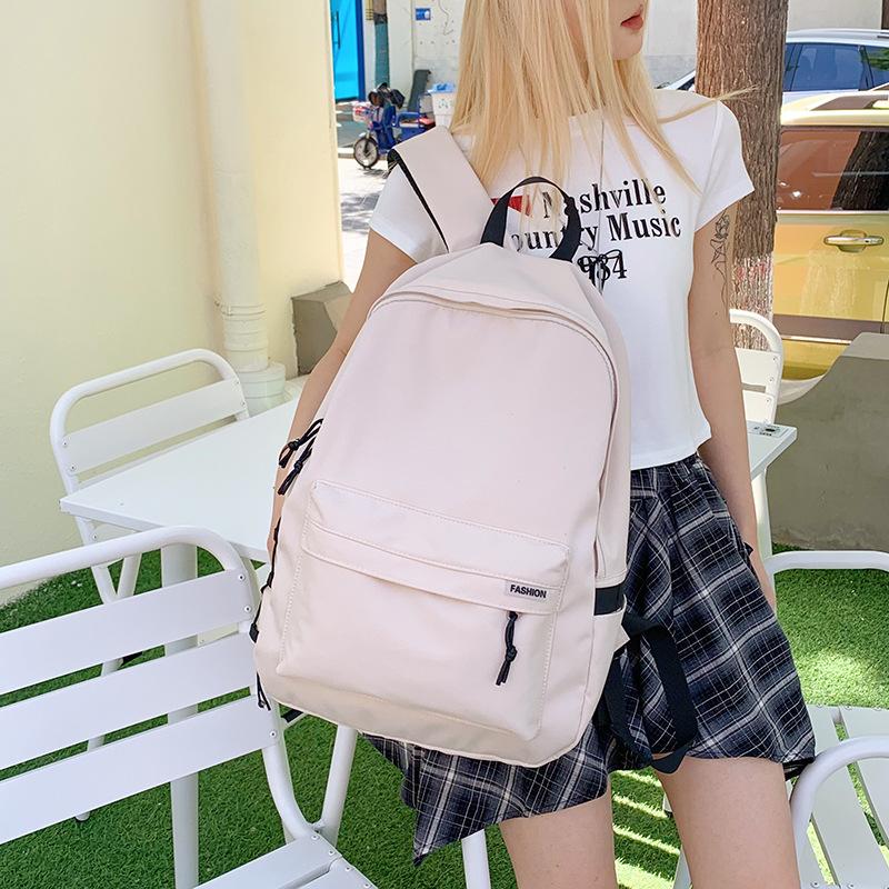 New junior high school primary school students schoolbag large capacity lightweight backpack girl simple leisure travel backpack tide