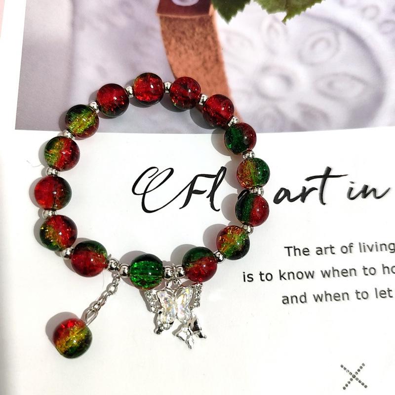 Temu Weihnachtsarmband mit Knisterperlen und Schneeflocken-, Baum-, Weihnachtsmann-, Glockenanhängern