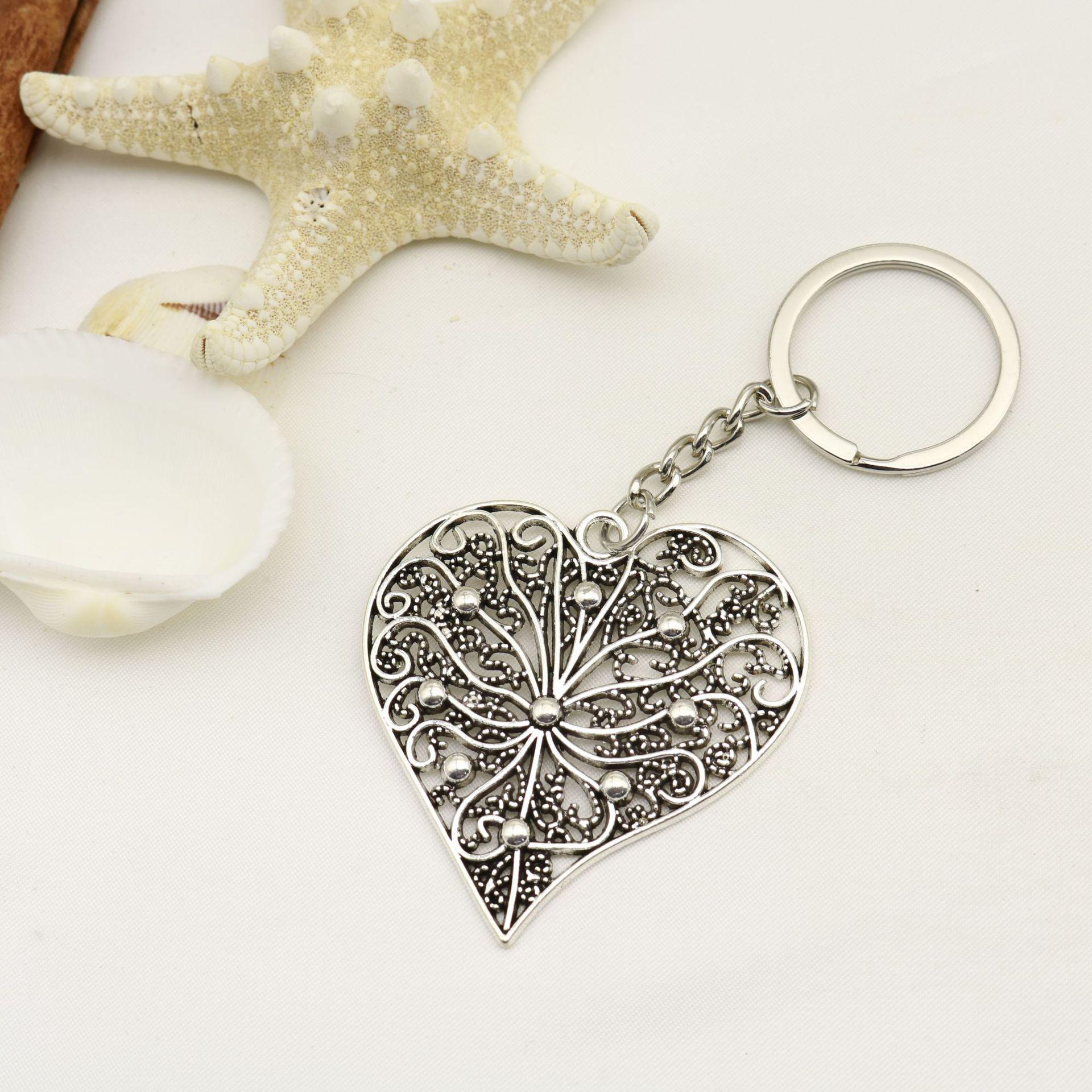 Heart-Shaped Hollow Carved Keyring Pendant