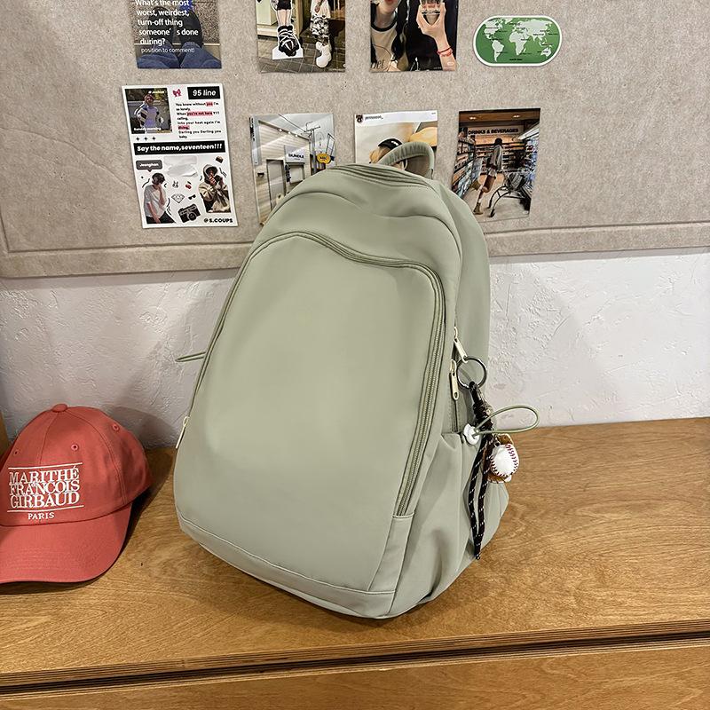 Casual solid color large-capacity schoolbag 2025 new versatile junior high school backpack college student travel backpack tide