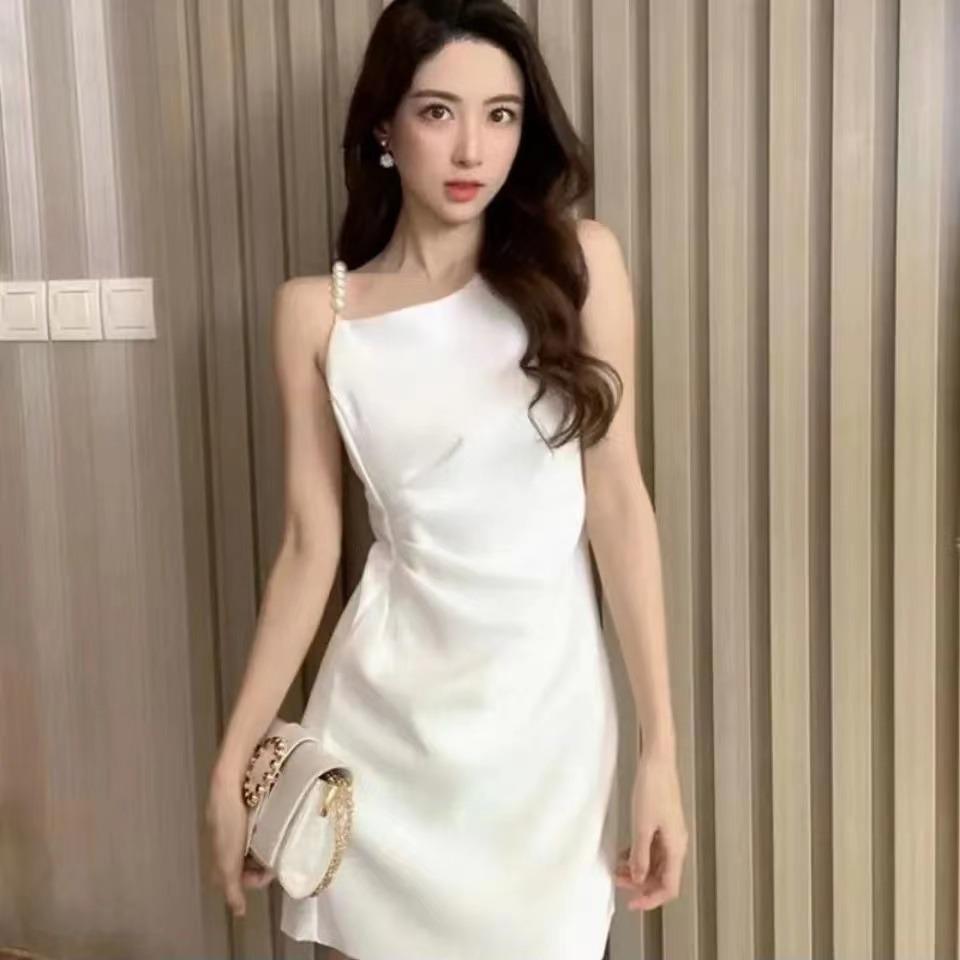 Foreign style solid color new pearl suspender dress women's summer French temperament slim and thin fashion short skirt