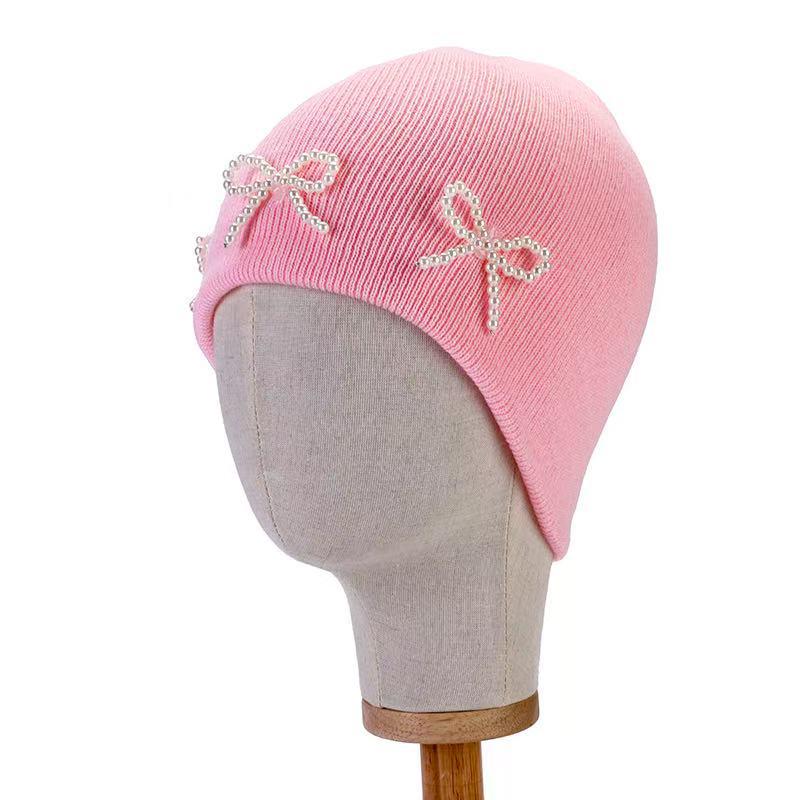 Pearl Bow Knit Hat: Trendy Korean-Style Autumn/Winter Pullover with Ear Protection.