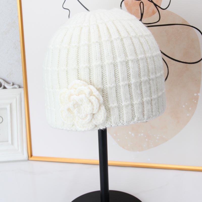 Three-dimensional flower knitted headgear women's autumn and winter face small warm windproof cold hat ear protector wool hat pullover hat