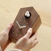 Soothing cuckoo chirps that arrive with the A wooden cuckoo clock that can be placed on a table or mounted on a "Cuckoo Clock" - time. (walnut) wall.