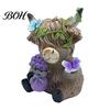 Whimsical Courtyard Sculptures Lavender Highland Cow Resin Figurine, Cute Fluffy with Butterfly Bow & Floral Wreath, Animal Figurines Pastel