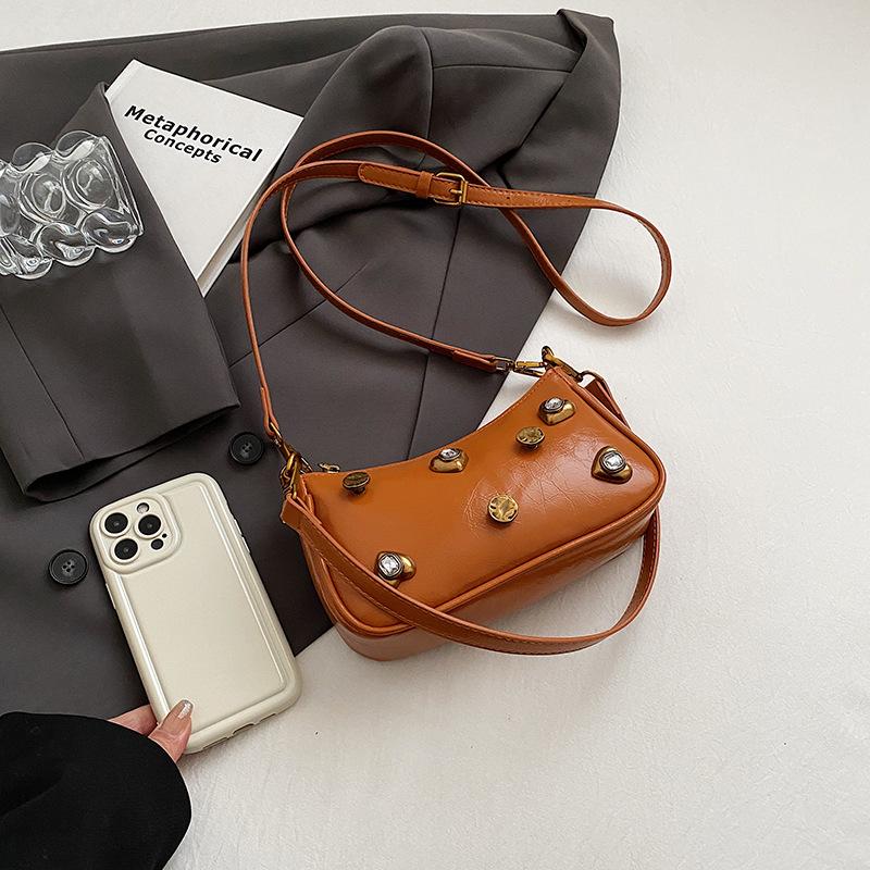 Woman Bags bag 2025 new Korean version of fashion rivets personalized trend women's shoulder crossbody armpit bag