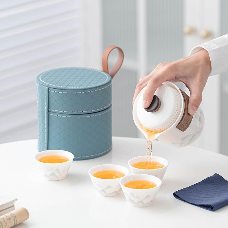 Flower travel tea set, light luxury and portable, one pot and four cups of Ru kiln car business gifts
