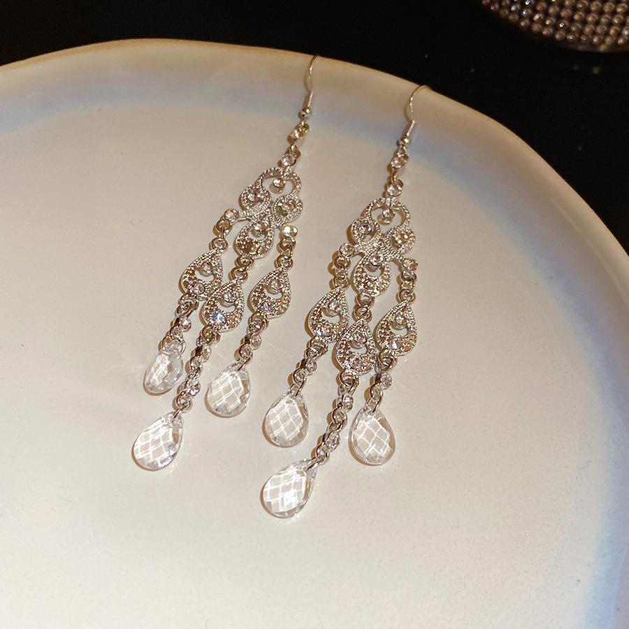 

European and American diamond-encrusted water droplets hollow fringed ears court style heavy industry earrings light luxury high-end earrings