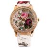 Orologio da polso da donna al quarzo con quadrante rotondo intarsiato di strass a forma di fiore e cinturino in ecopelle