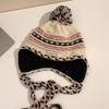 Cozy Chic Knitted Winter Hat For Women Featuring Colorful Pom Poms And Warmth